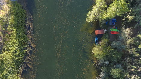 man launches kayak boat and goes kayaking on the russian river in northern california, usa