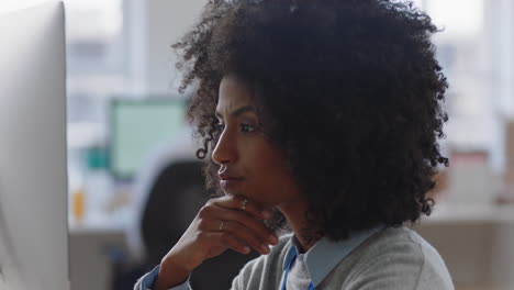 young mixed race business woman using computer brainstorming problem solving idea looking pensive thinking of solution in office workplace