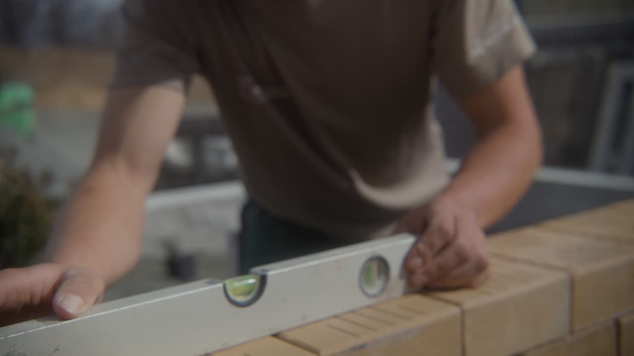 Man taking measurement using spirit level