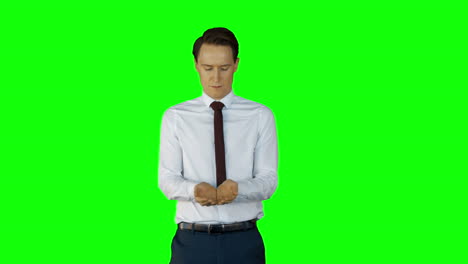 businessman wearing something with his hands on green screen