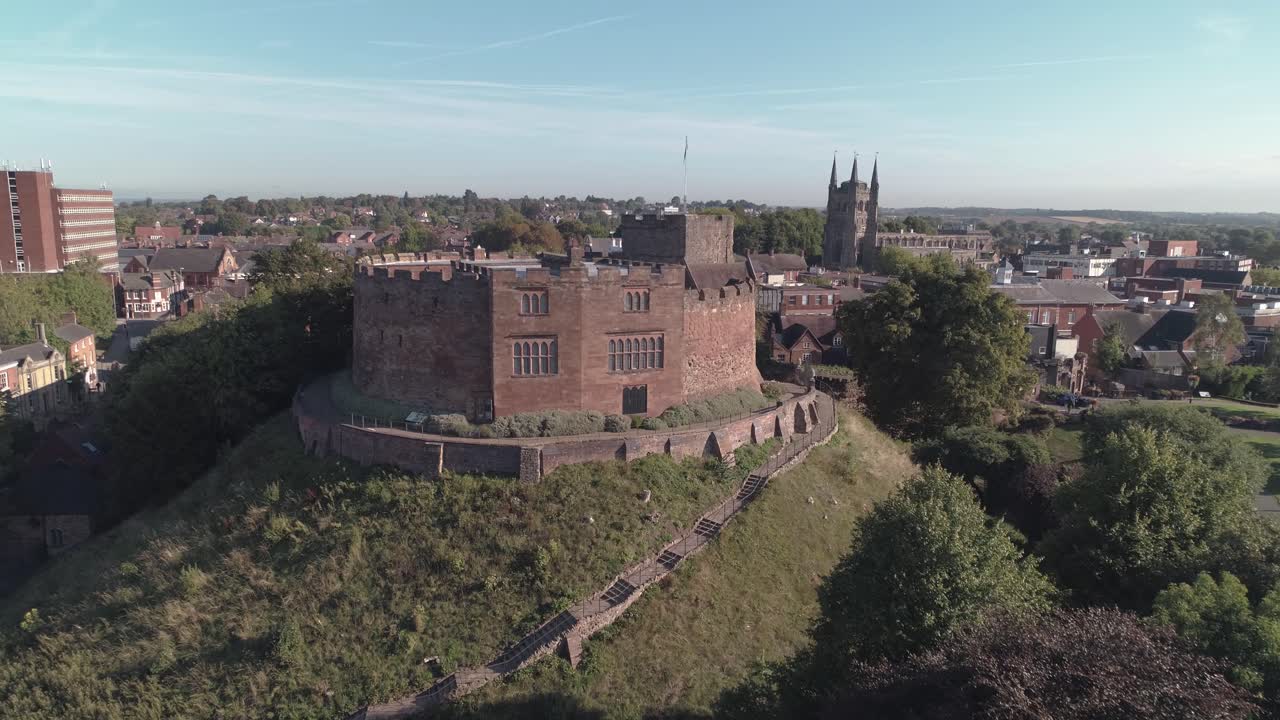 Aerial crane style shot up and over Tamworth Castle towards the town