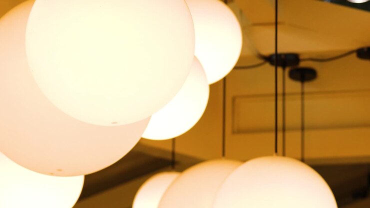 Warmly lit spherical lamps in a cozy setting