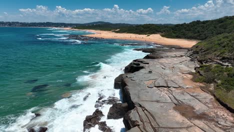 Central-Coast-Panorama:-Pristine-Waters-and-Rocky-Shores-of-Spoon-Bay-Uncovered,-Australia
