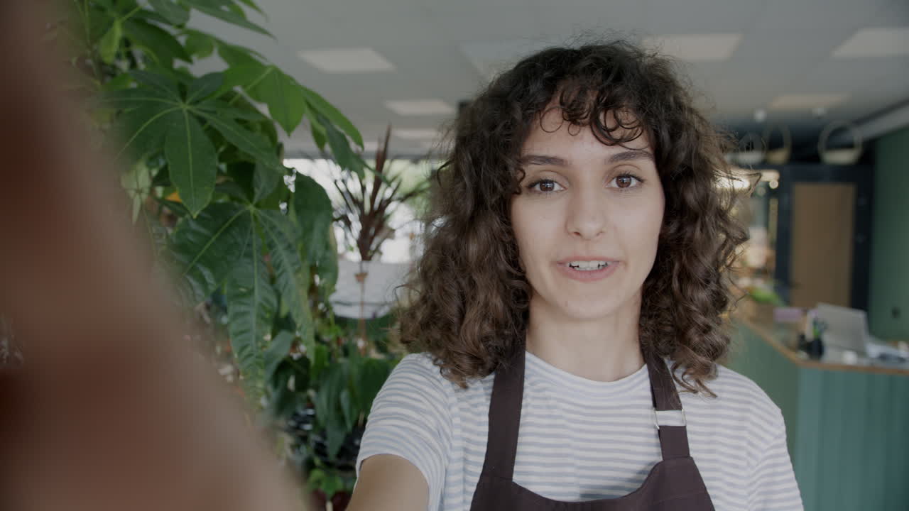 Happy Florist Taking a Selfie in Her Shop