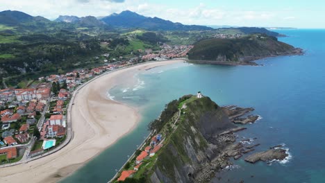 Ribadesella-Beach,-Cliffs-and-Coastal-Town-in-Asturias,-Costa-Verde,-North-Spain---Aerial-4k