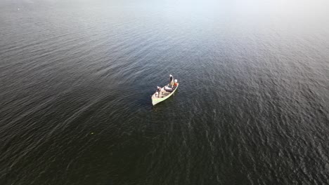 lure fishing boat on large silver lake, ireland