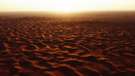 Aerial-view-of-4x4-off-road-land-vehicle-taking-tourists-on-desert-dune-bashing-safari-in-Dubai,-UAE