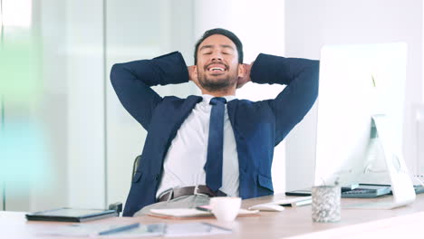 relaxed business man sitting with hands behind