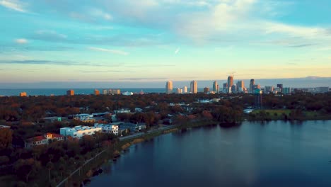 4k aerial video of downtown st petersburg tilting down to crescent lake park