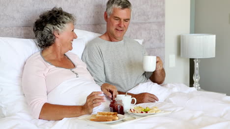 mature couple having breakfast together