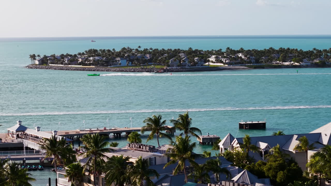 AERIAL: Race boats driving on the sea, in front of Key West, sunrise in Florida