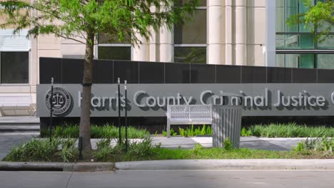 establishing shot of the harris county criminal justice center in houston, texas