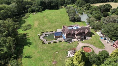 luxury landscaped celebrity real estate aerial view over neglected unfinished property and gardens