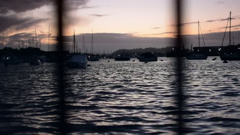 low down shot of the sun setting over the harbour