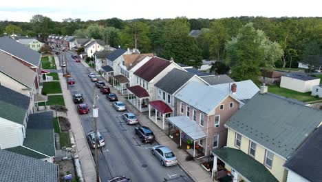 aerial view of a residential street with cars and row houses