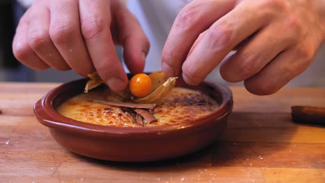 the chef decorates the pudding in a bowl