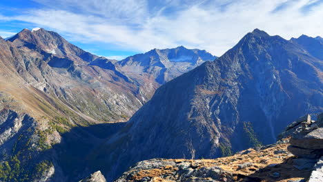 Summer-Alphabel-Saastal-Saas-Fee-Switzerland-top-of-Swiss-Alps-glacier-mountain-peaks-summer-early-morning-stunning-vibrant-clear-blue-sky-alpine-valley-Zermatt-pan-left-slowly