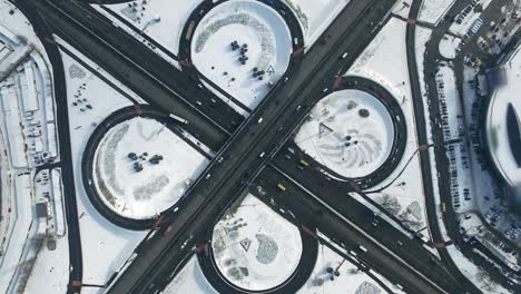 top view freeway intersection. aerial view cars traffic on winter highway