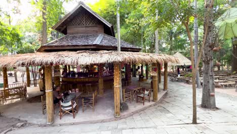 outdoor bamboo bar and restaurant in a tropical garden