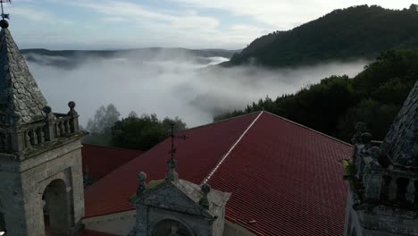 drone shot over old christian monastery: fog at sil canyon, luintra, spain