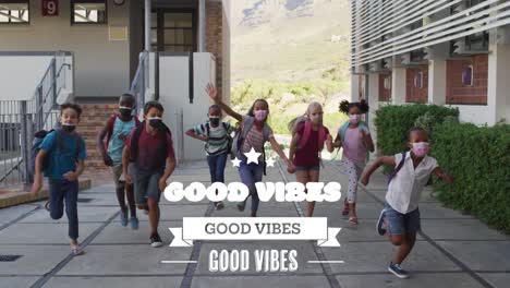 animation of good vibes text over diverse schoolchildren running with face masks