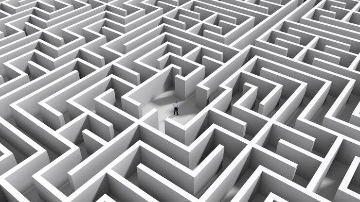 Businessman standing in middle of maze