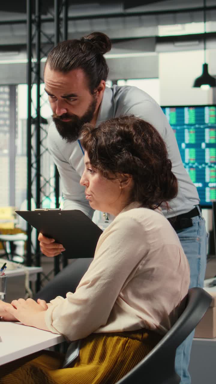 Vertical Video Professional colleagues team analyzing online graphs and resource allocation