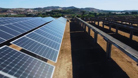 solar power plant park, cinematic aerial view of big solar panels array, revealing drone shot