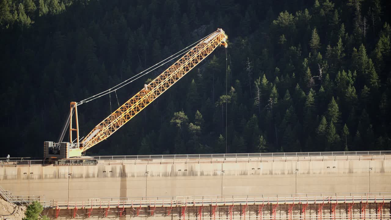 A construction crane working on the dam at Gross Reservoir in Boulder County, Colorado, USA