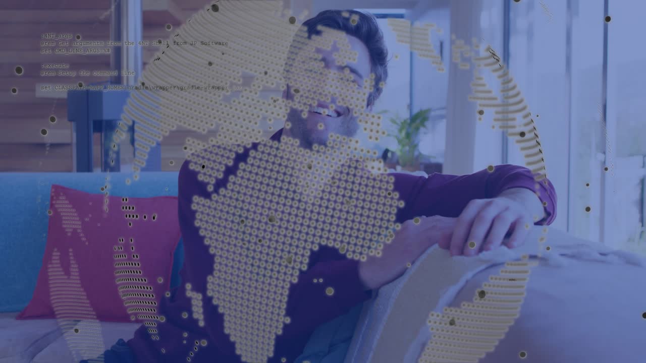 Man reclining and shifting on couch causing globe and code overlay to swirl during tech demo