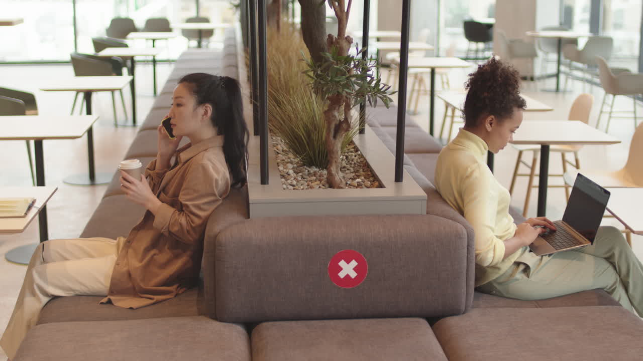 Women Working on Distance in Restaurant