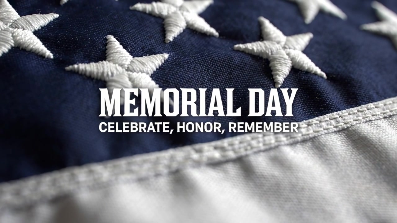Obiettivo che mette a fuoco rivelando stelle cucite su una bandiera USA in primo piano, evidenziando il testo MEMORIAL DAY.