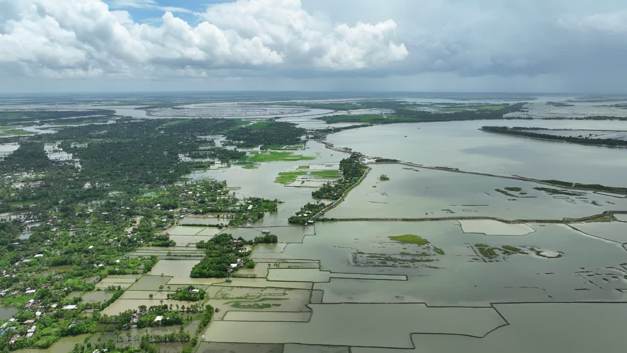 Drone shot of severe flooding, submerged homes, roads, and agricultural fields caused by collapse of river embankment due to strong tidal surge, Satkhira coastal region, Bangladesh