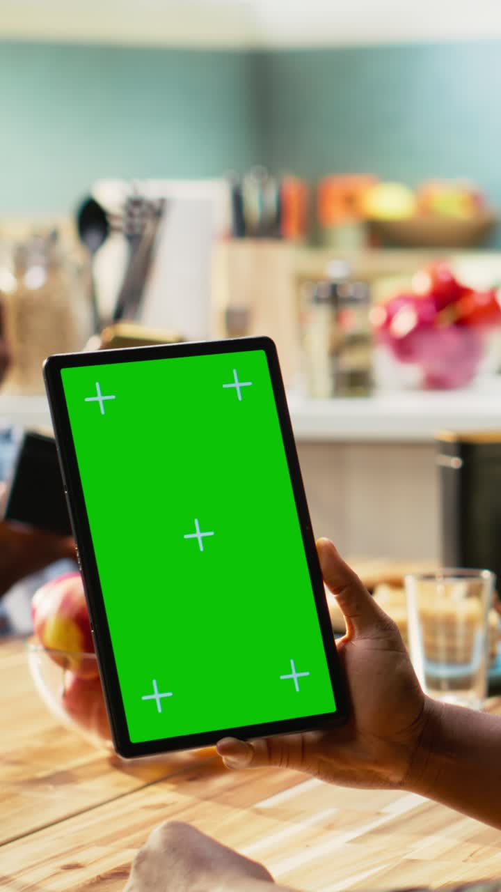 Vertical Video Vertical green screen next to parents and kids sharing breakfast in kitchen