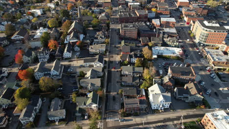 aerial view of downtown concord, new hampshire state capital city, flying above neighborhood on sunny fall day, drone shot