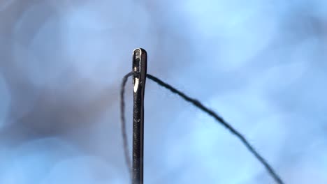 Threading-a-needle-in-macro-scale