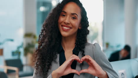 Heart-hands,-smile-and-woman-in-modern-office