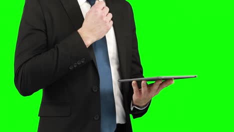 Businessman-using-his-digital-tablet-