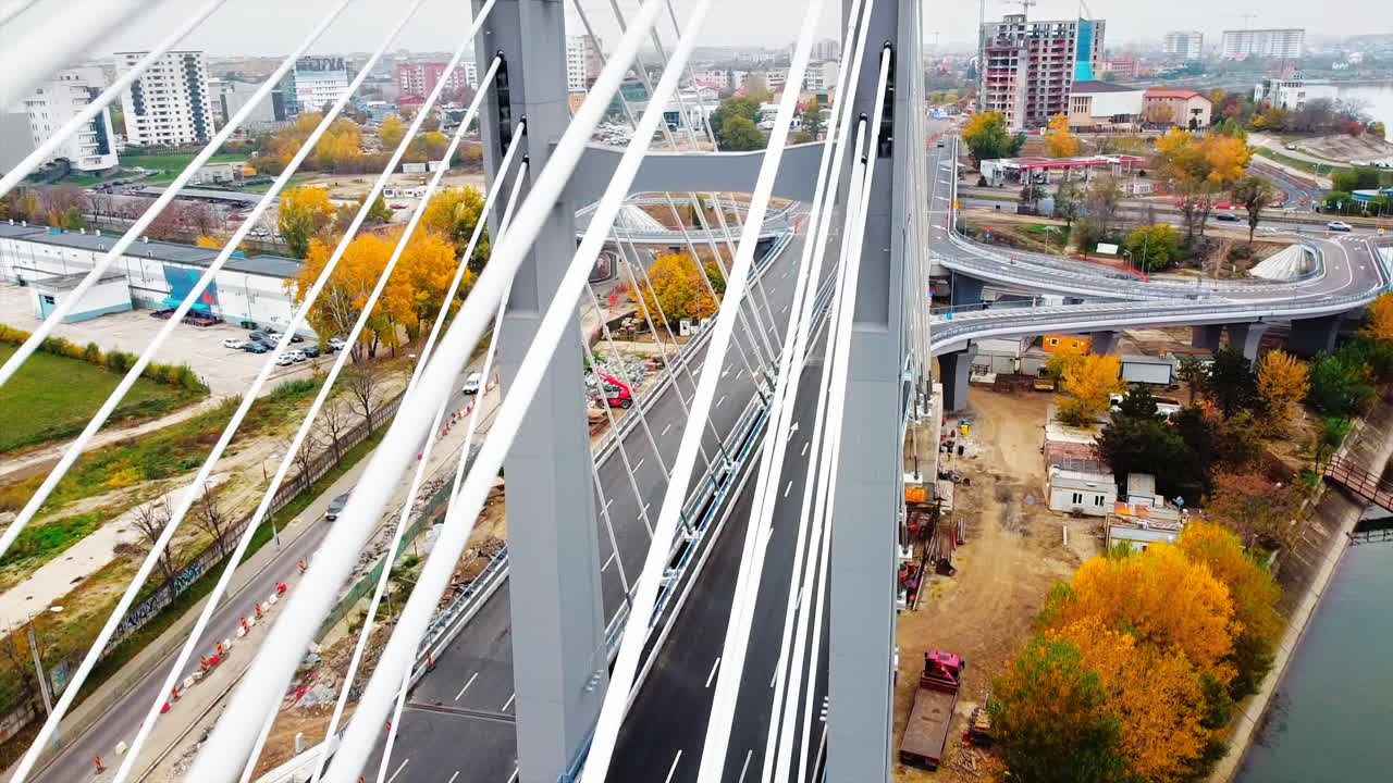 Ciurel passage, bridge over a river with moving cars, construction works near it. View from the drone. Bucharest, Romania