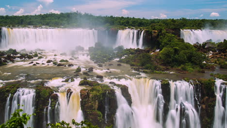 Timelapse-of-Waterfalls-of-Iguazu-around-a-big-green-area,-in-a-sunny-day,-Foz-do-Iguacu,-Parana,-Brazil