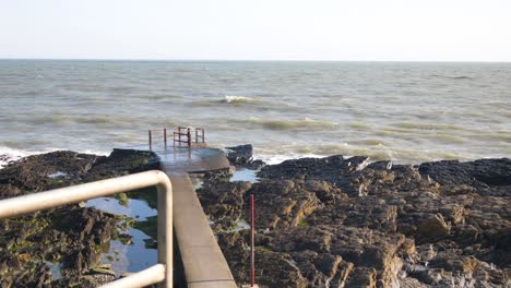 Portmarnock-Beach,-Fingal,-Dublin,-Ireland---Picturesque-View-of-the-Beach's-Rocky-Coast---Wide-Shot