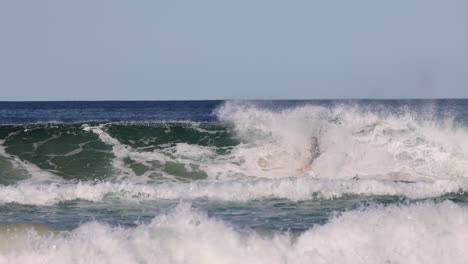 sequence of a surfer catching and falling off a wave