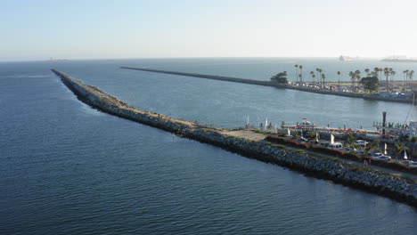 Beautiful-aerial-shot-of-piers-at-Seal-Beach-in-California-in-summer-sun