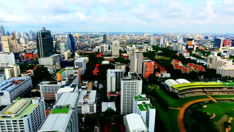 4k.aerial central park in bangkok, thailand green with lake.golf course and business center.central park - in bangkok - lumpini park