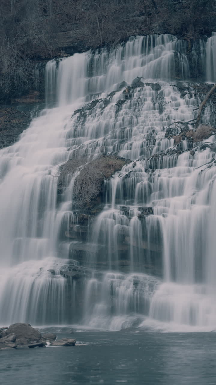 Multi-Tier Waterfall in a Forest Landscape | Premium Stock Video Footage