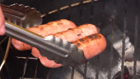 grilled hot dogs on a charcoal grill