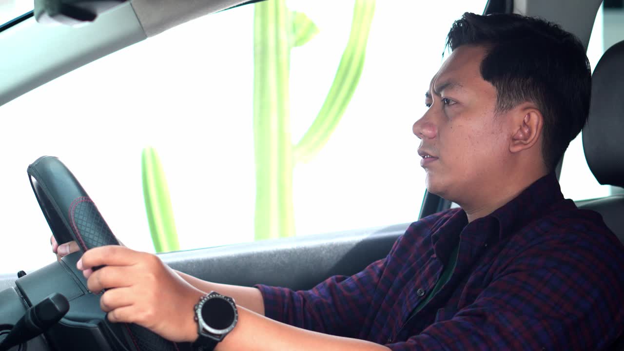 Tired Driver Man outstretched Hands While Sitting In The Car