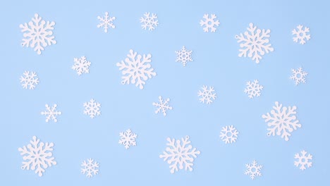 rotating snowflakes on pastel blue theme. christmas stop motion