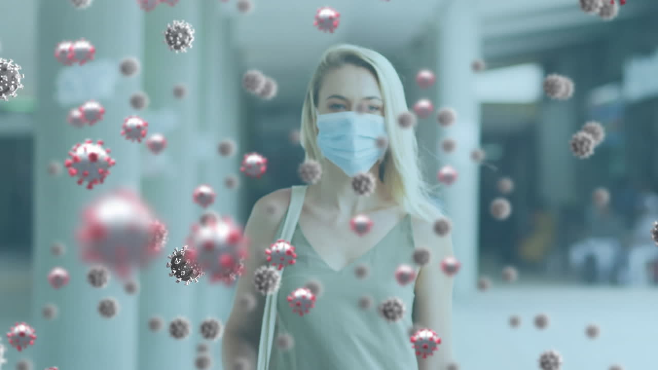 animación de las células del virus de la covid-19 sobre una mujer que usa una máscara facial