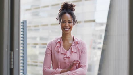 portrait of happy african american businesswoman in creative office